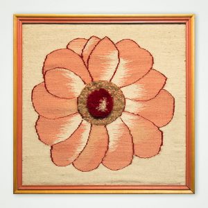 hand woven textile wall panel in a frame flower